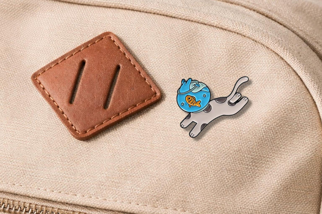 Playful Cat Fishbowl Enamel Pin – Cute Cat Carrying Fish Tank Brooch – Kawaii Animal Lapel Badge – Whimsical Pet Lover Jewelry Gift